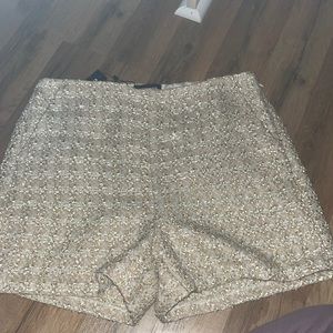 Golden tan shorts size 10 never been worn tags still on shorts. From express.